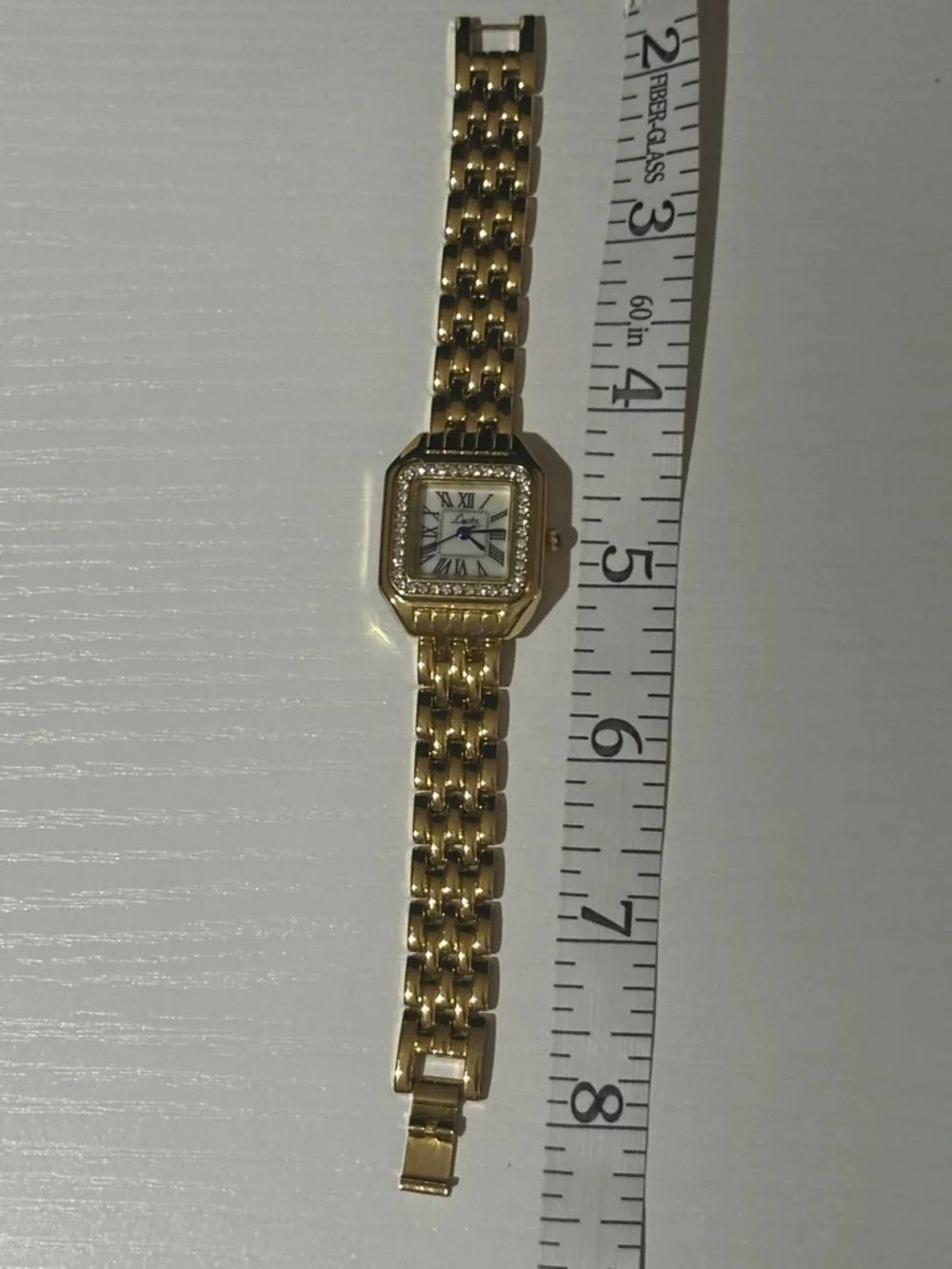 Elegant Gold-Tone Women's Crystal Bezel Watch with Blue Hands